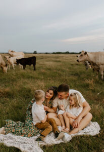 family photo with cows in austin texas
