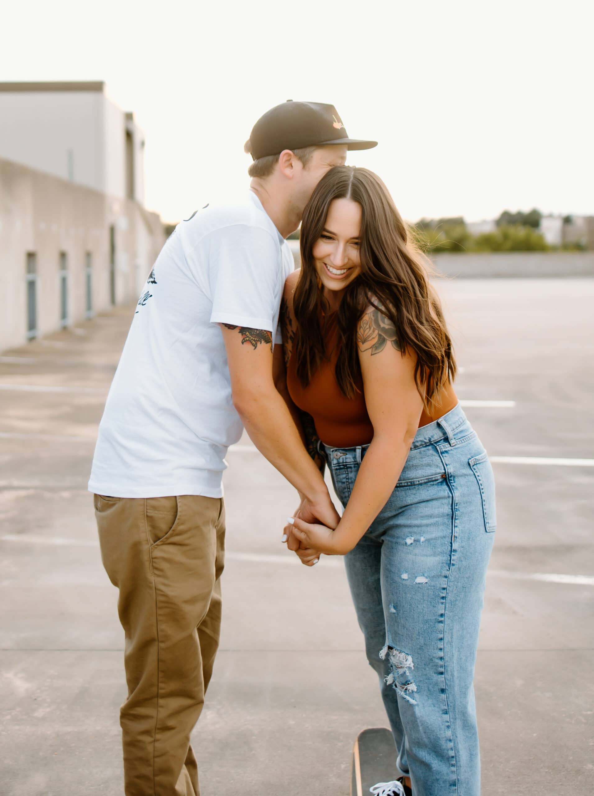 couple holding hands during rooftop photo