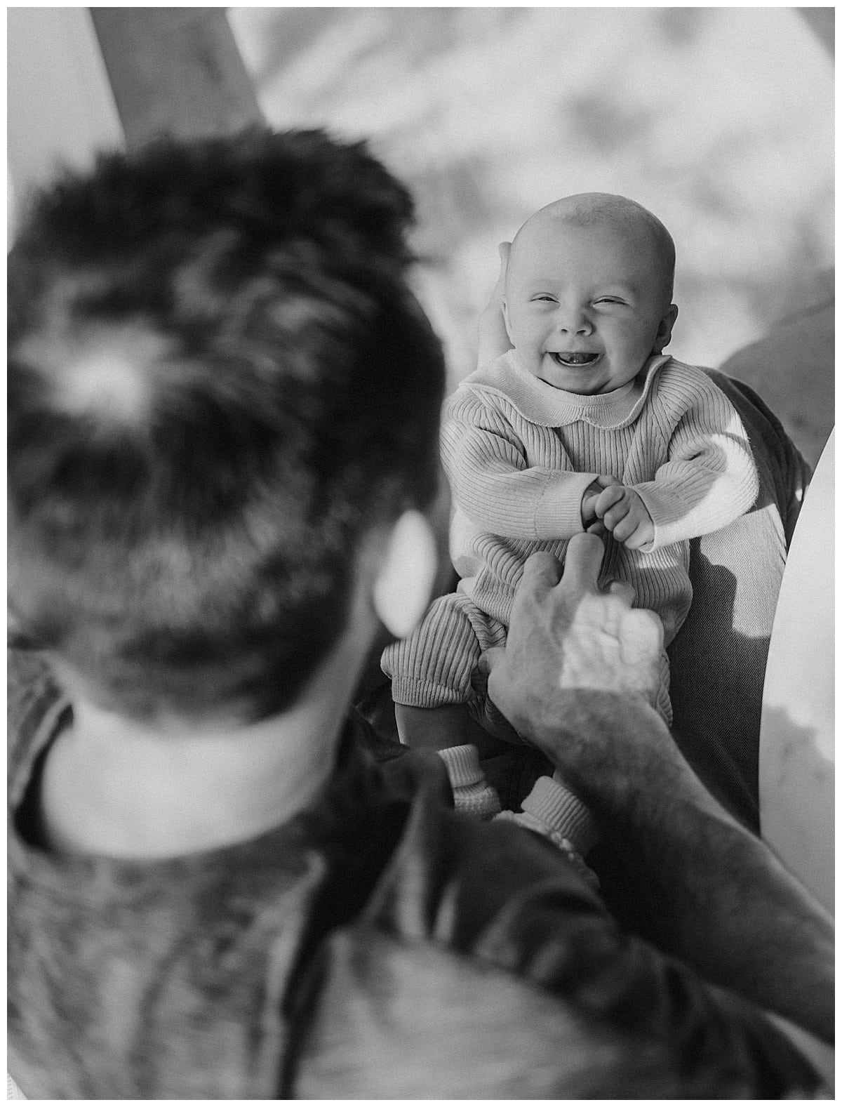Baby smiles at dad for In-Home Newborn Session