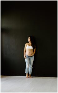 Mom holds pregnant belly for Austin Motherhood Photographer