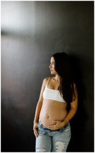 Mom hold belly for Studio Maternity Photos