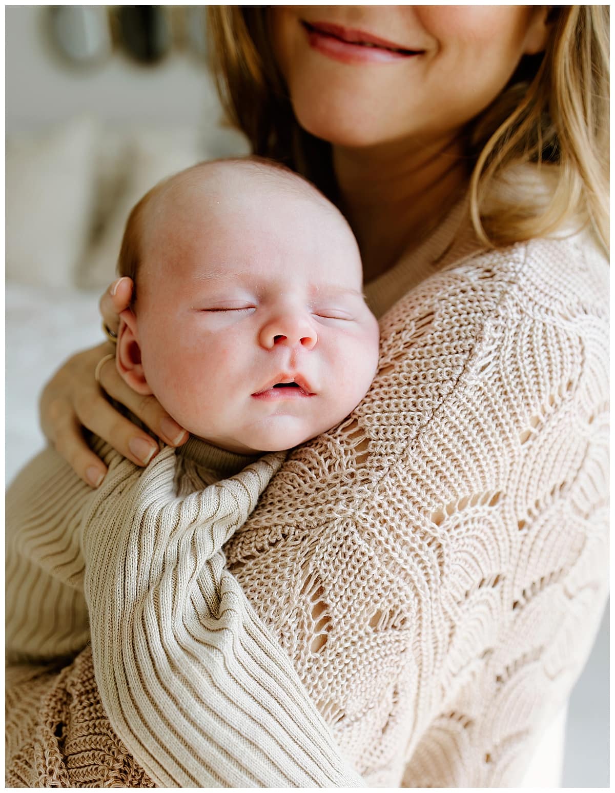 Mom holds infant baby for Austin Motherhood Photographer