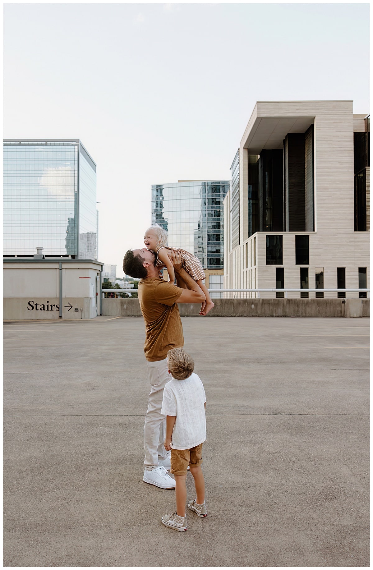 Dad enjoys time with sons for Downtown Austin Rooftop Family Session 