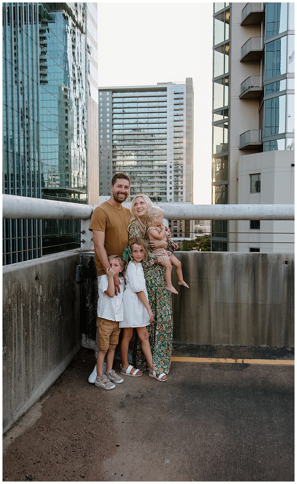 Parents hold kids close for Austin Lifestyle Photographer