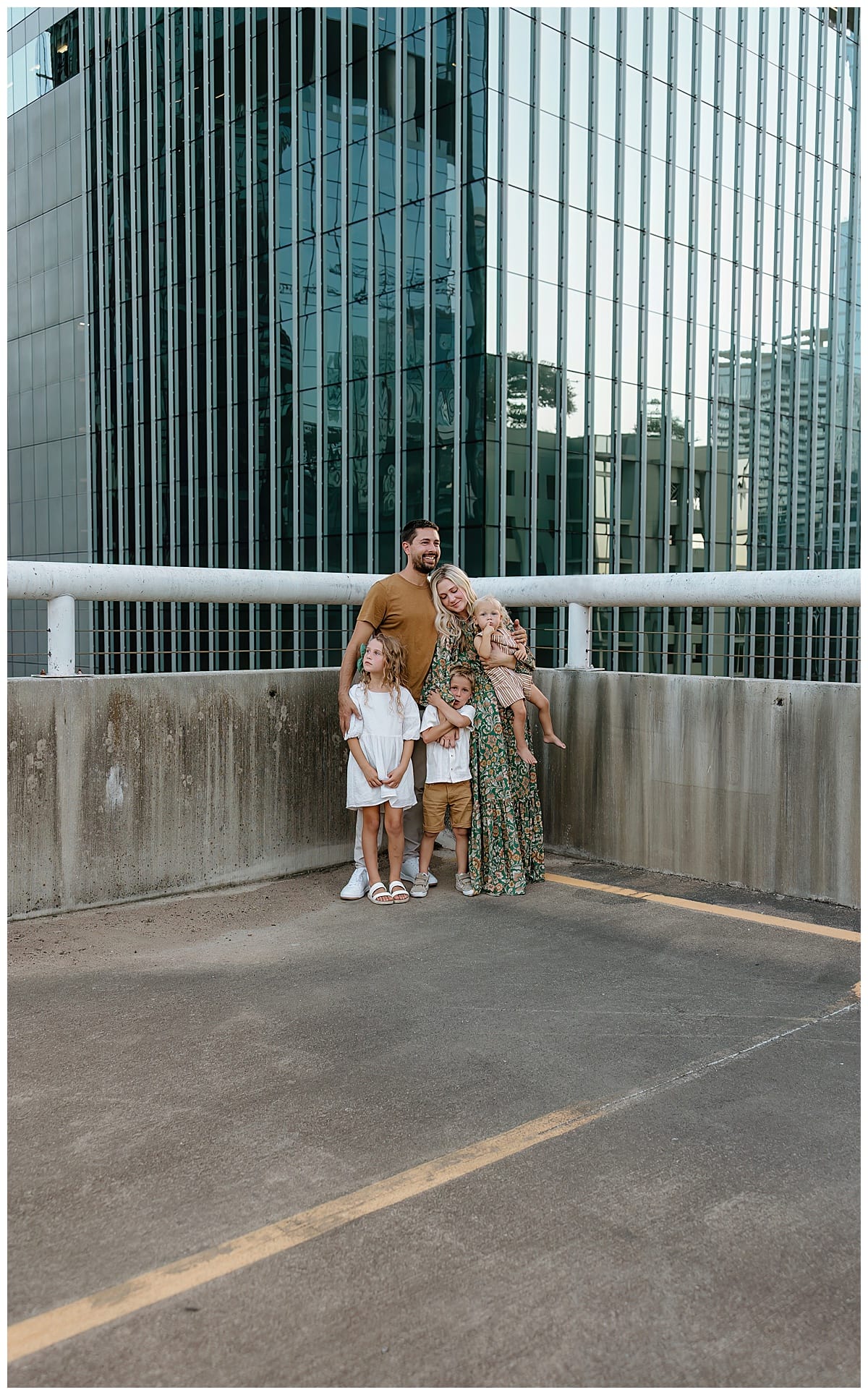 Family stands together for Downtown Austin Rooftop Family Session 