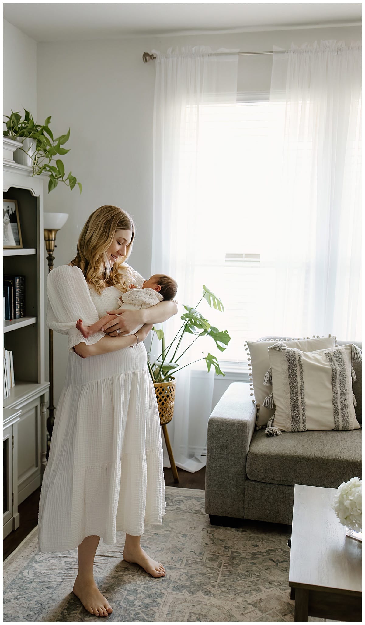 Mom admires baby for Austin Newborn Photographer