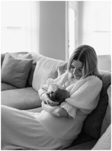 Mom breastfeeds baby for In-Home Newborn Storytelling Session