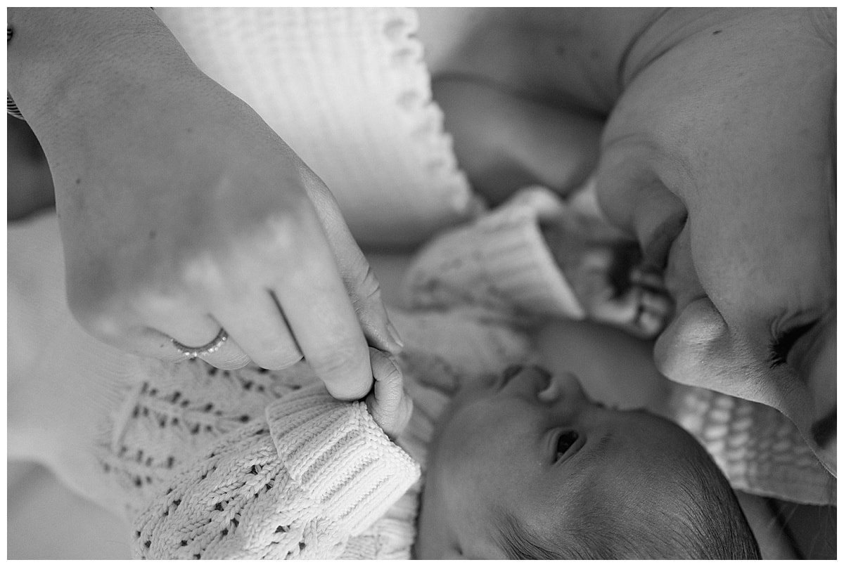 Mom cuddled baby for Austin Newborn Photographer