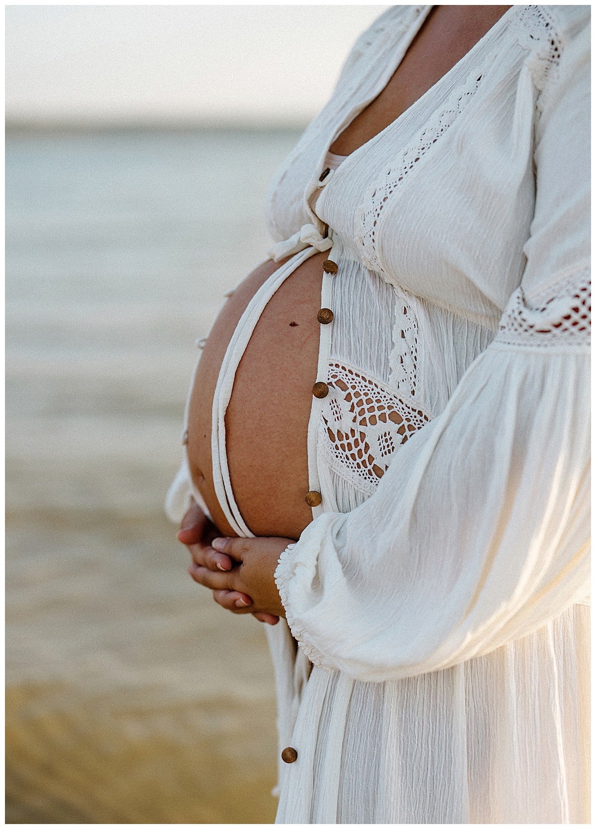Woman embraces pregnant belly for Austin Motherhood Photographer