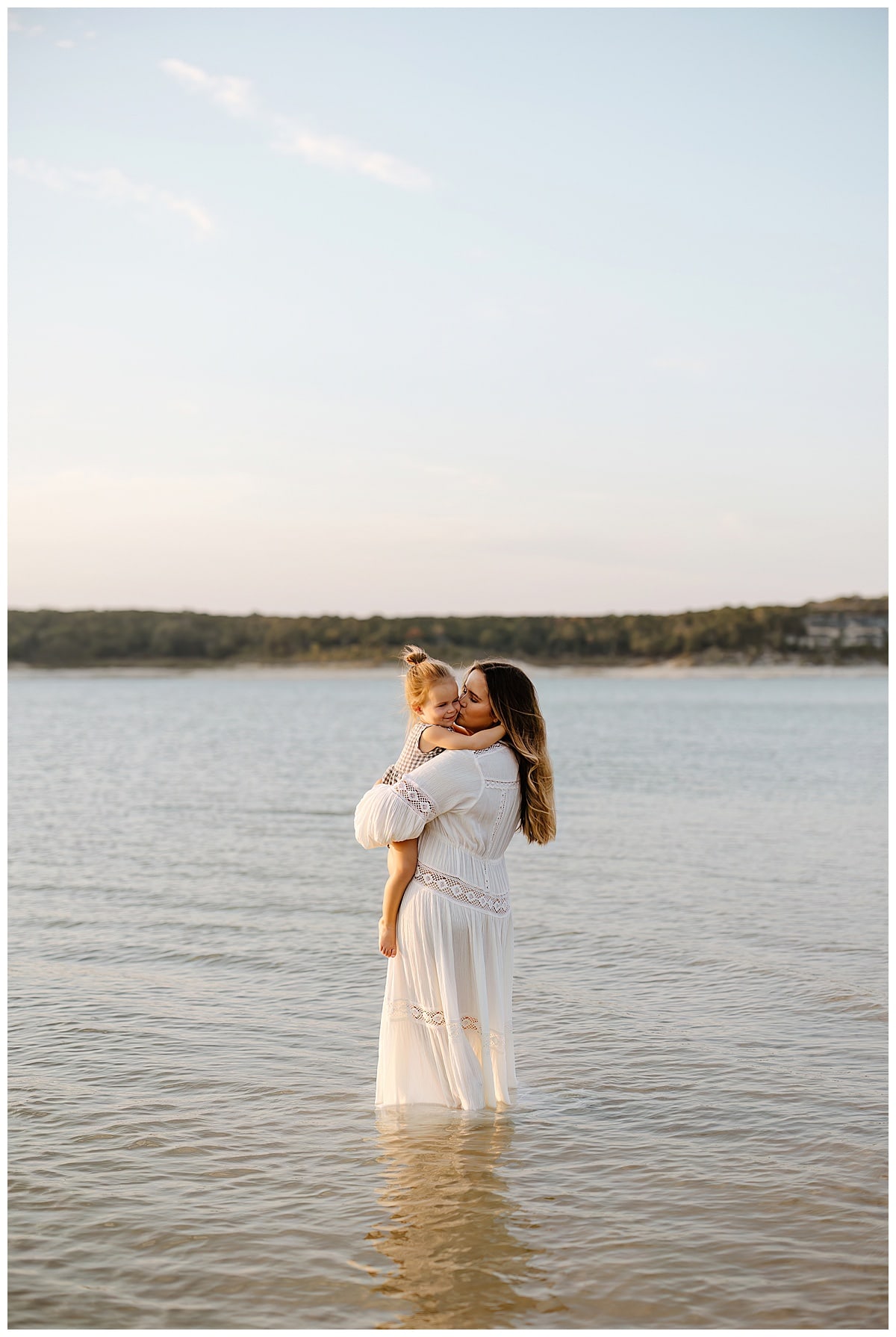 Mom and daughter share a kiss for Austin Motherhood Photographer