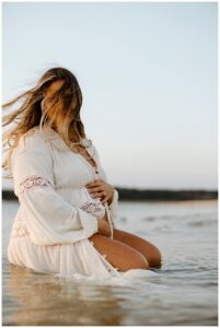 Mother holds pregnant belly for Our Adventuring Souls Photography
