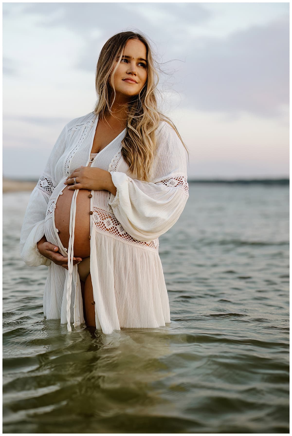 Woman holds pregnant belly for Our Adventuring Souls Photography