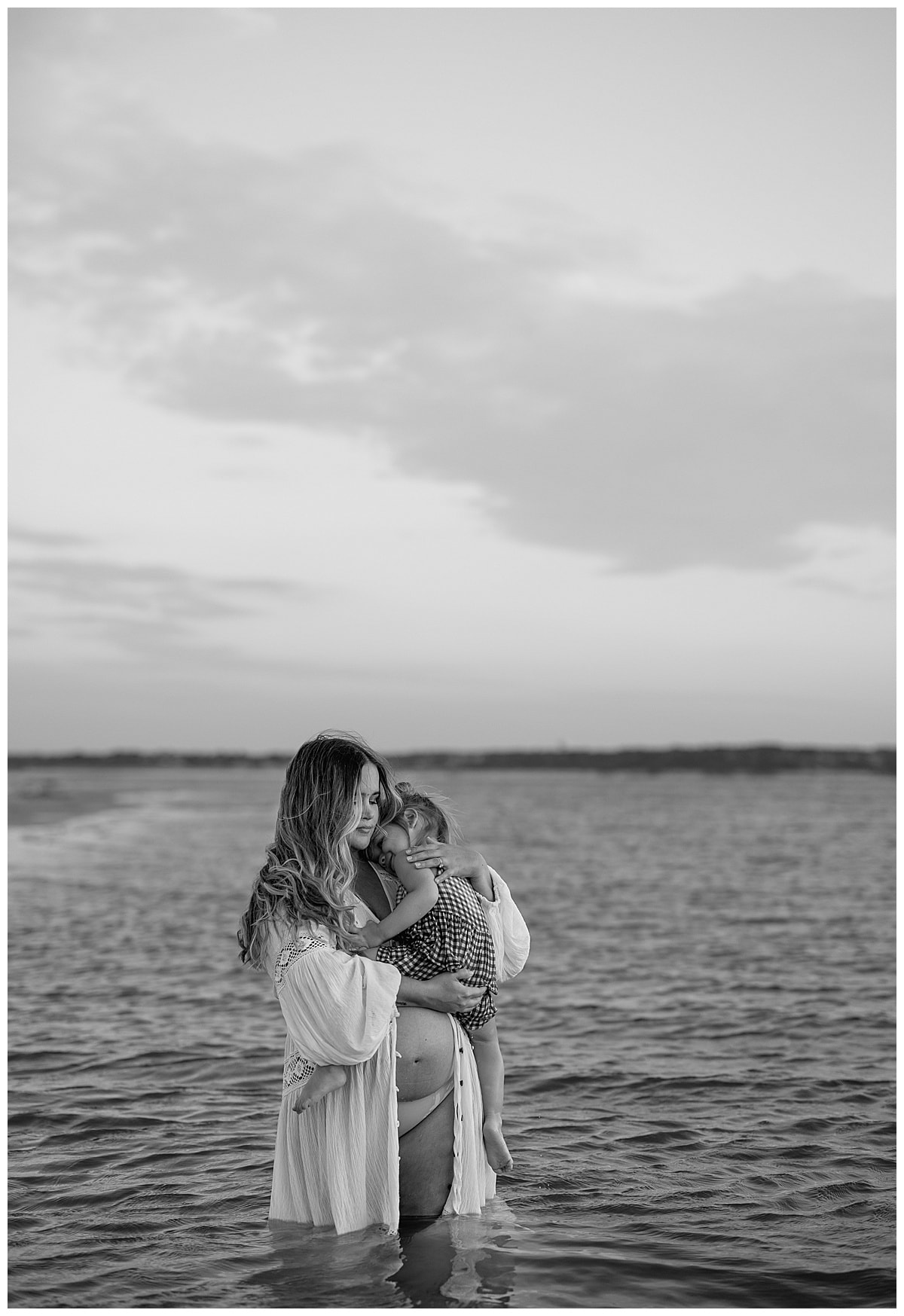 Mom and daughter hold one another for Austin Motherhood Photographer