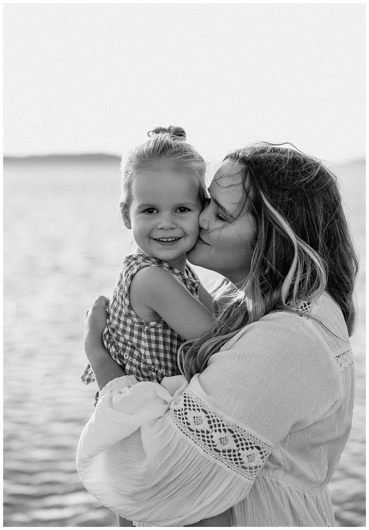 Mom kisses daughter for Our Adventuring Souls Photography