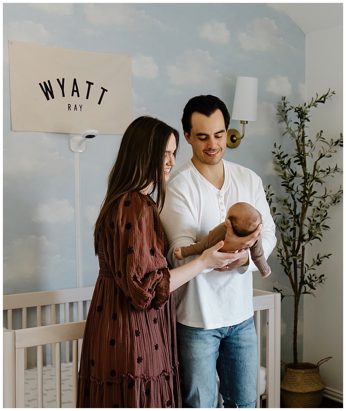 Mom and dad smile at baby for Austin Newborn Photographer