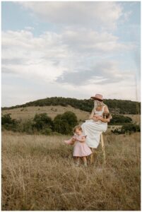 Mom sits on a stool with her daughters for Austin Lifestyle Photographer
