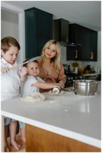 Mom bakes with sons during her in home maternity session