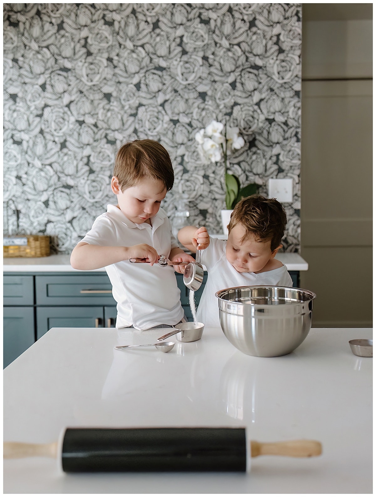 Little boys bake together during their Mom's in home maternity session