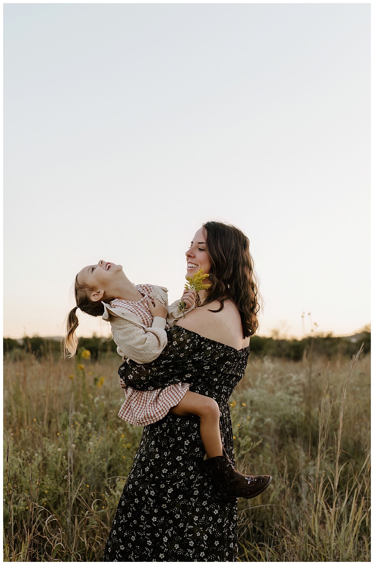 Young daughter laughs with her mom for Austin Lifestyle Photographer