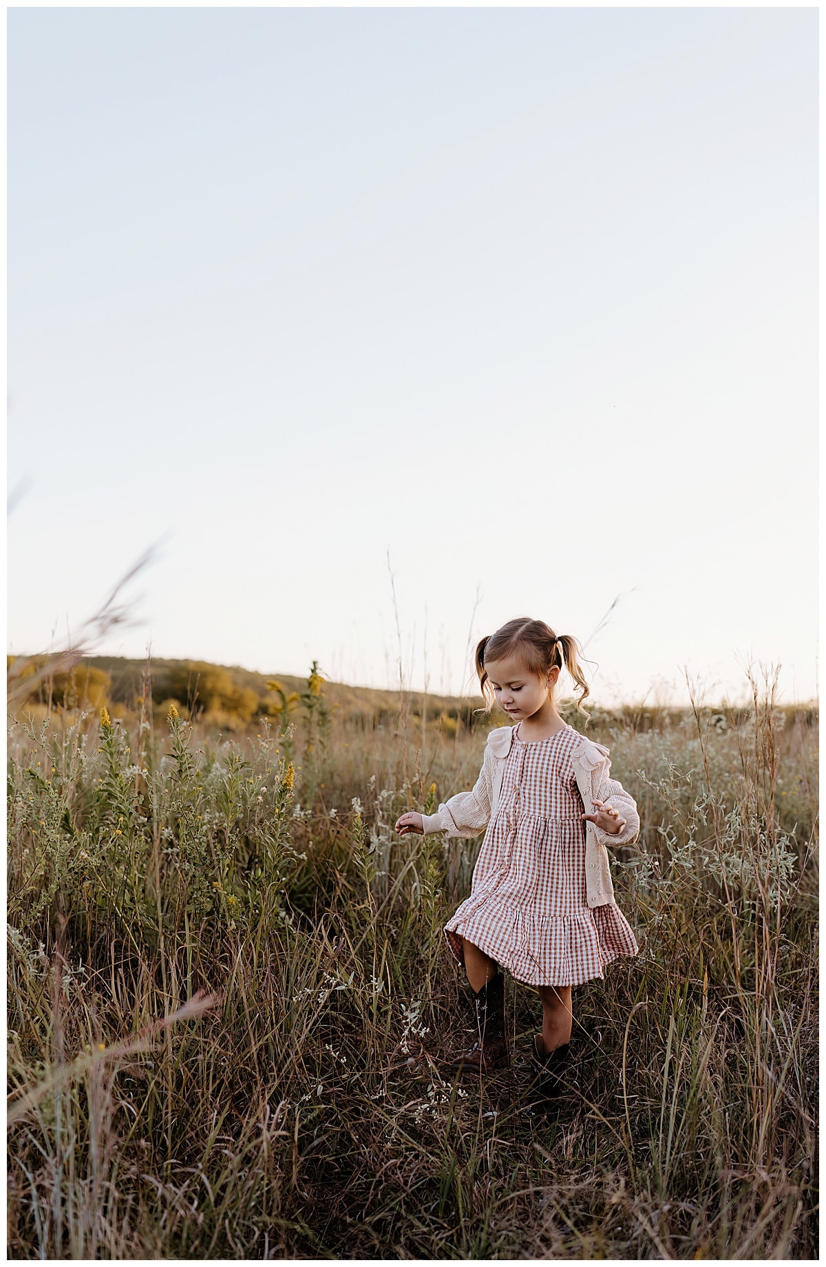 Young walks through field for Austin Lifestyle Photographer