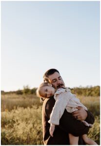 Little girls rest her head on dad's shoulder for Austin Lifestyle Photographer