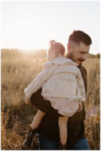 Little girl rest on dads shoulder for Austin Lifestyle Photographer