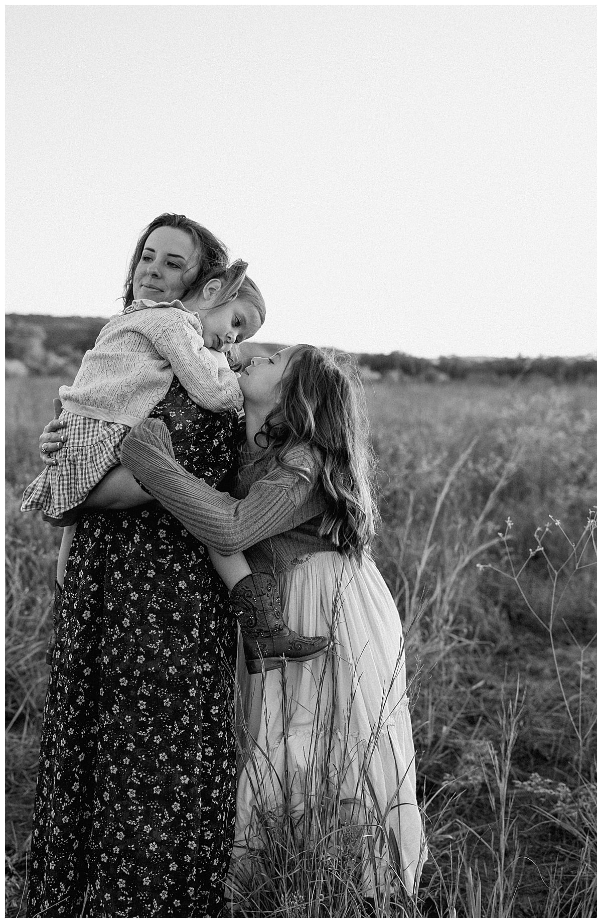Mom holds young daughter close for Our Adventuring Souls Photography
