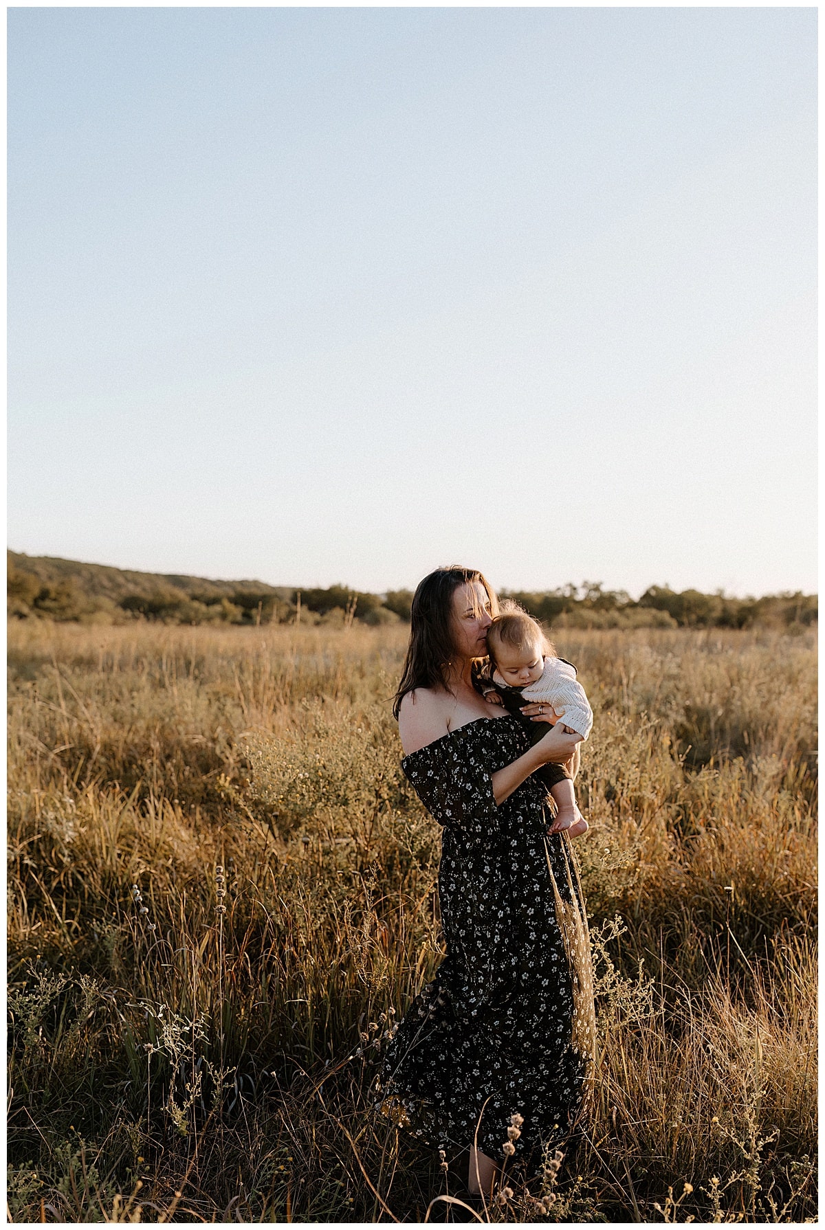 Mom holds little one close for Austin Lifestyle Photographer