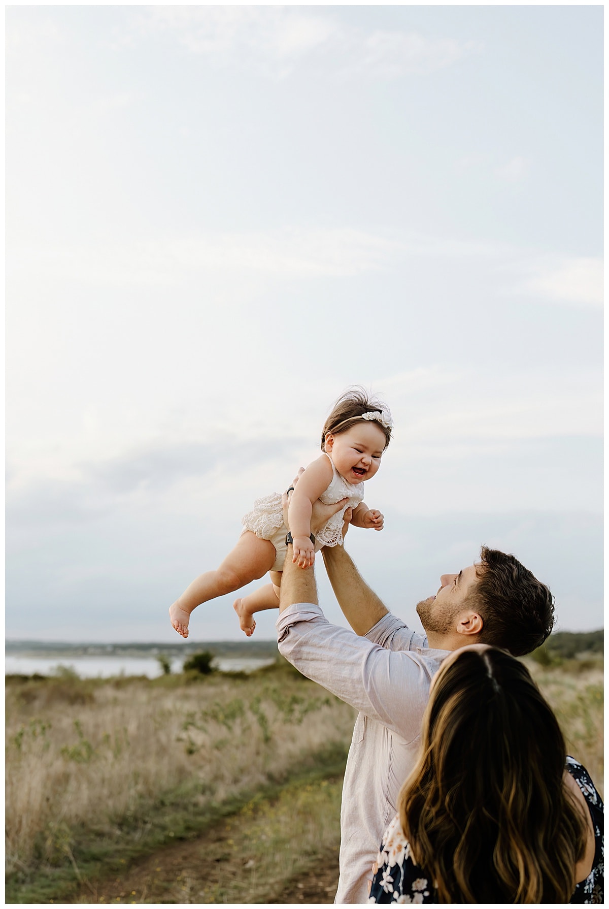 Dad throws baby in the air for Our Adventuring Souls Photography
