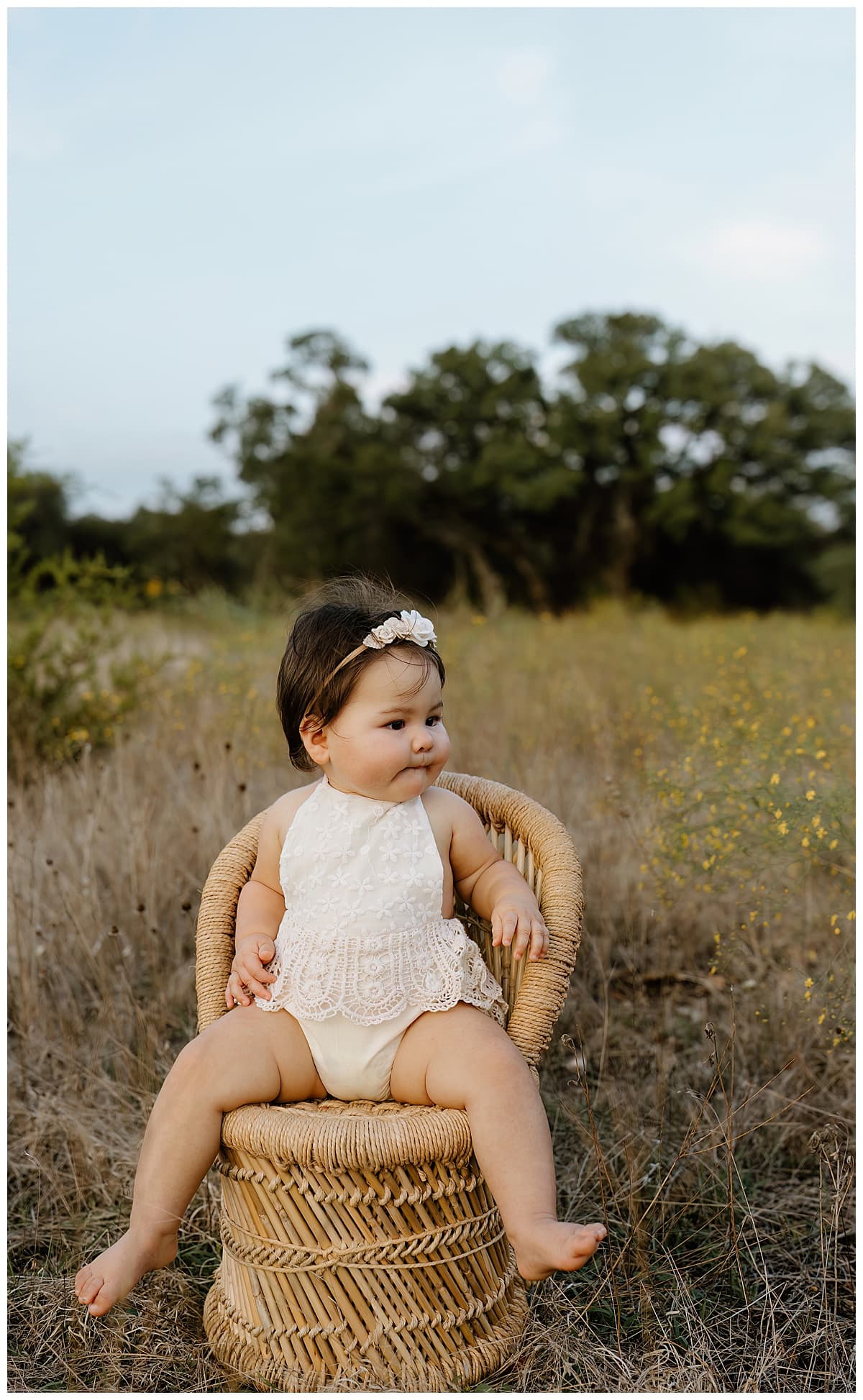 Baby girl sits on a chair for Austin Motherhood Photographer