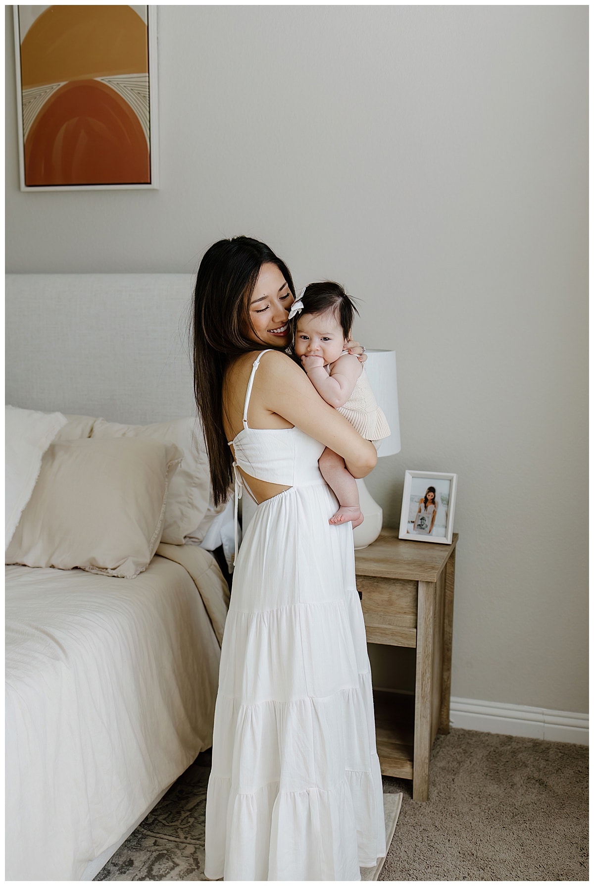 Mother holds baby girl close for Austin Motherhood Photographer