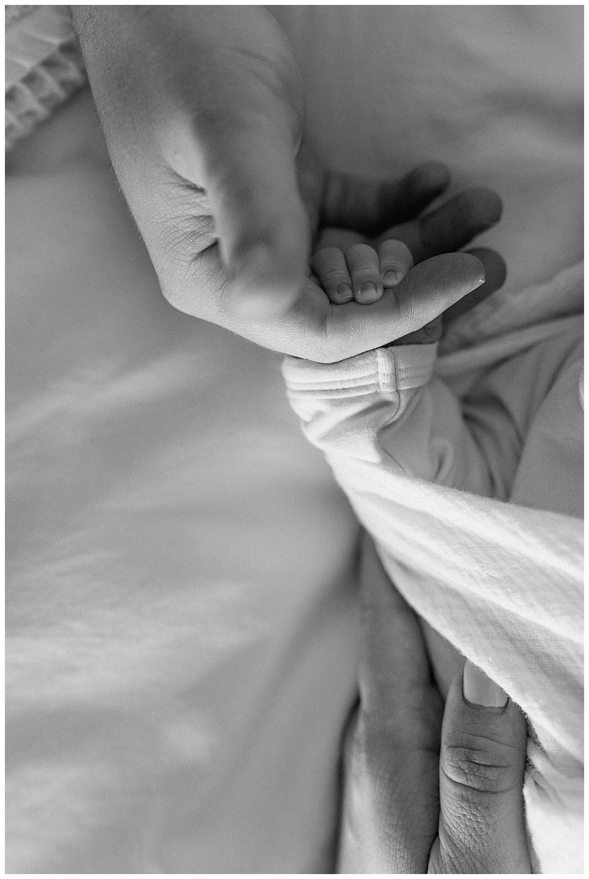 Parents hold newborns hands for Austin Lifestyle Photographer