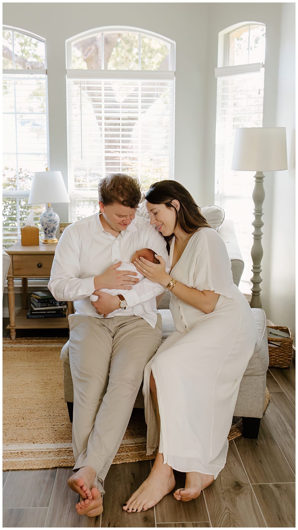 Mom and dad cuddle with newborn for Austin Lifestyle Photographer