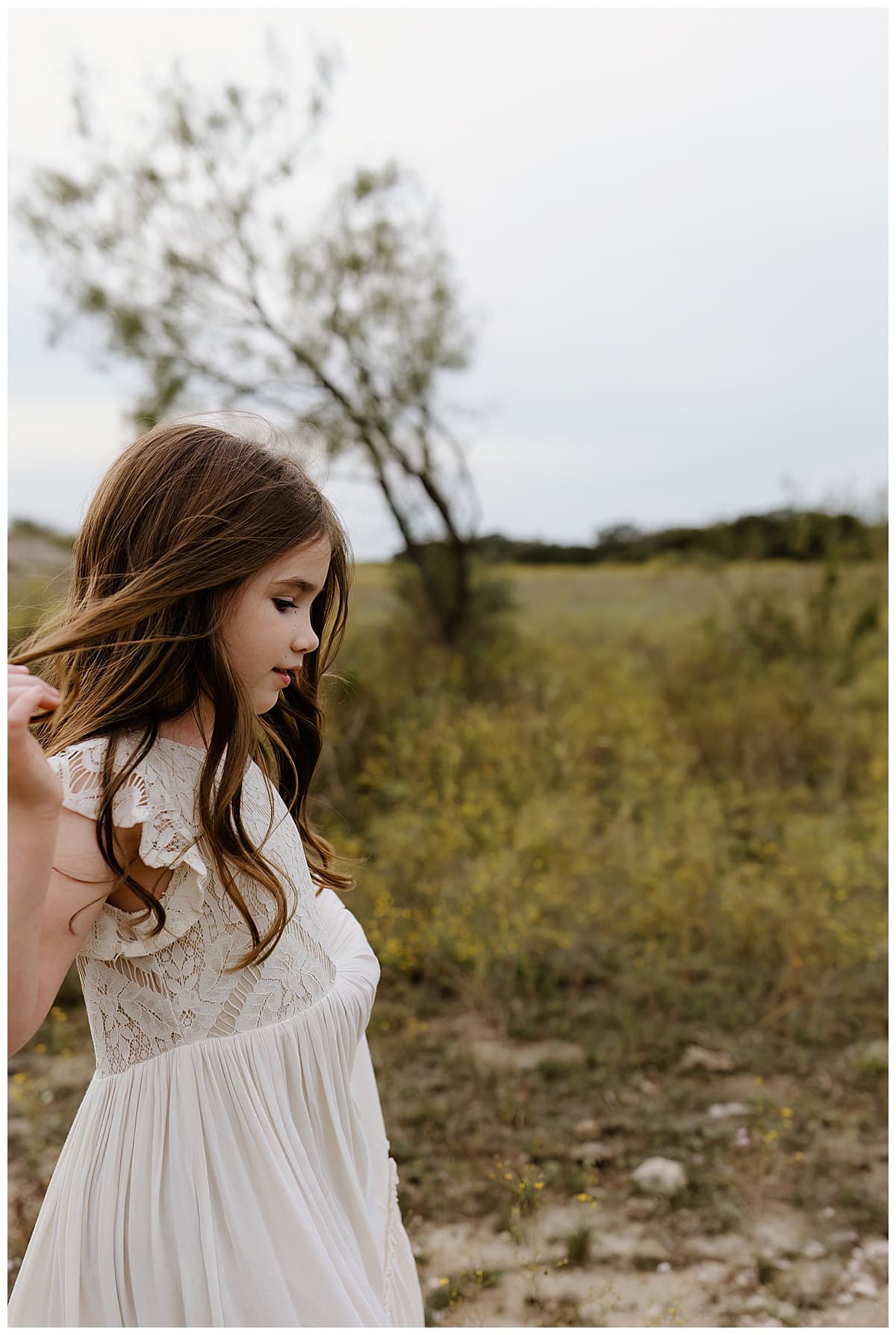Young girl walks through grass for Austin Lifestyle Photographer