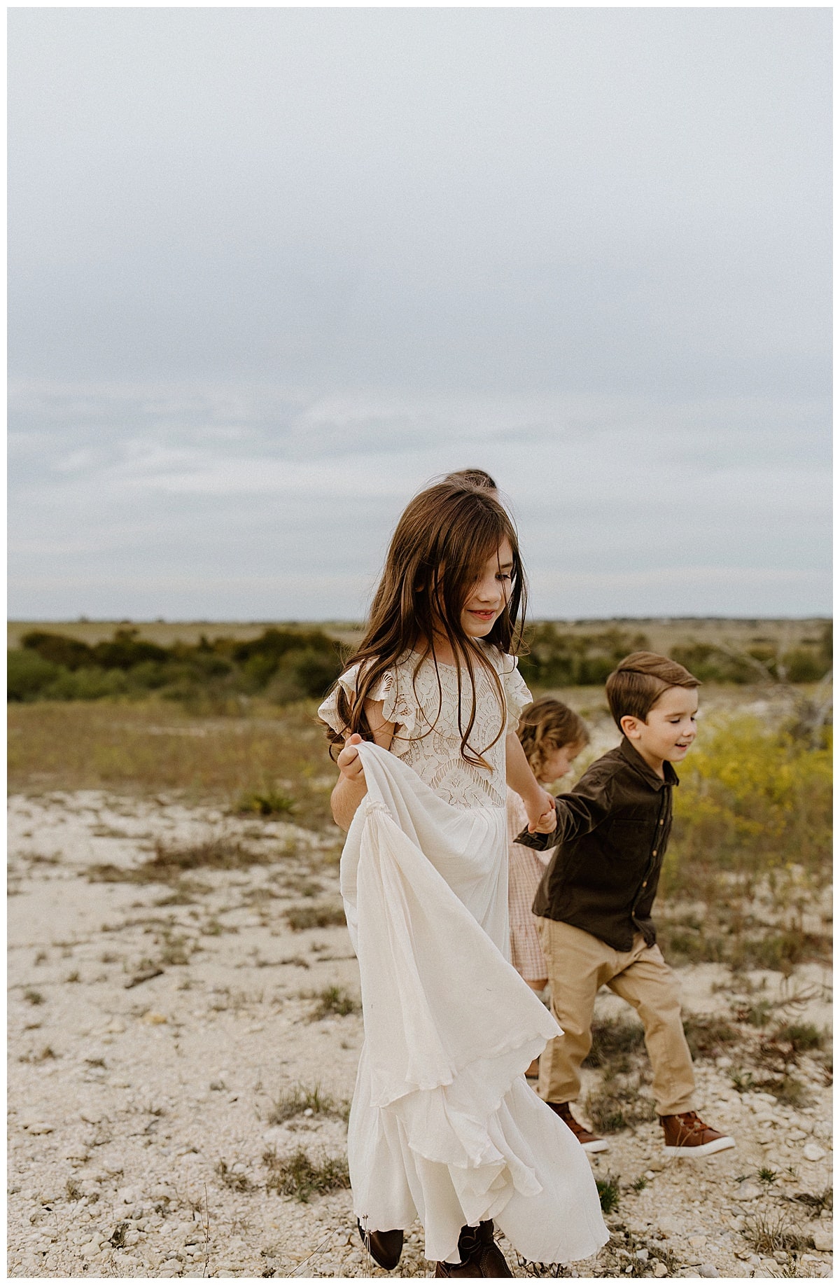 Young girl walks with siblings for Austin Lifestyle Photographer