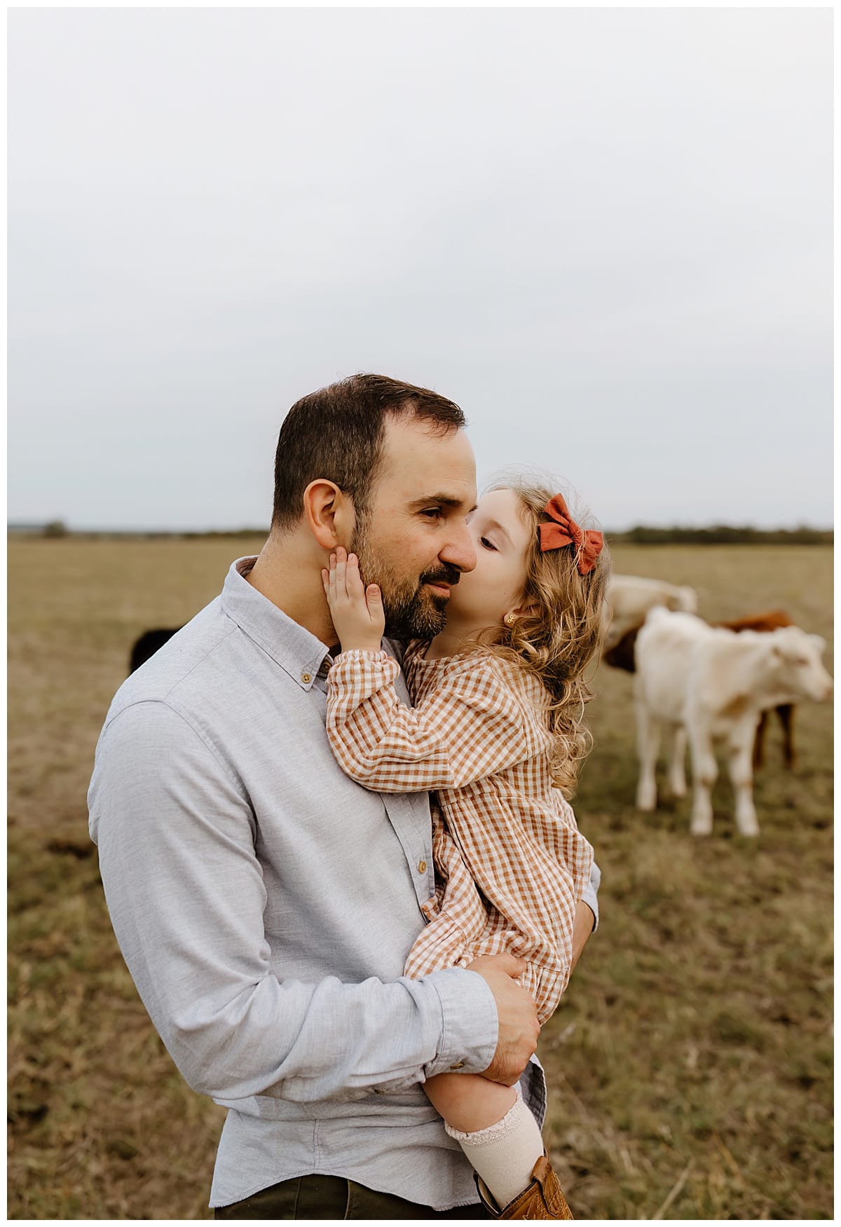 Little girls kisses her dad for Austin Lifestyle Photographer