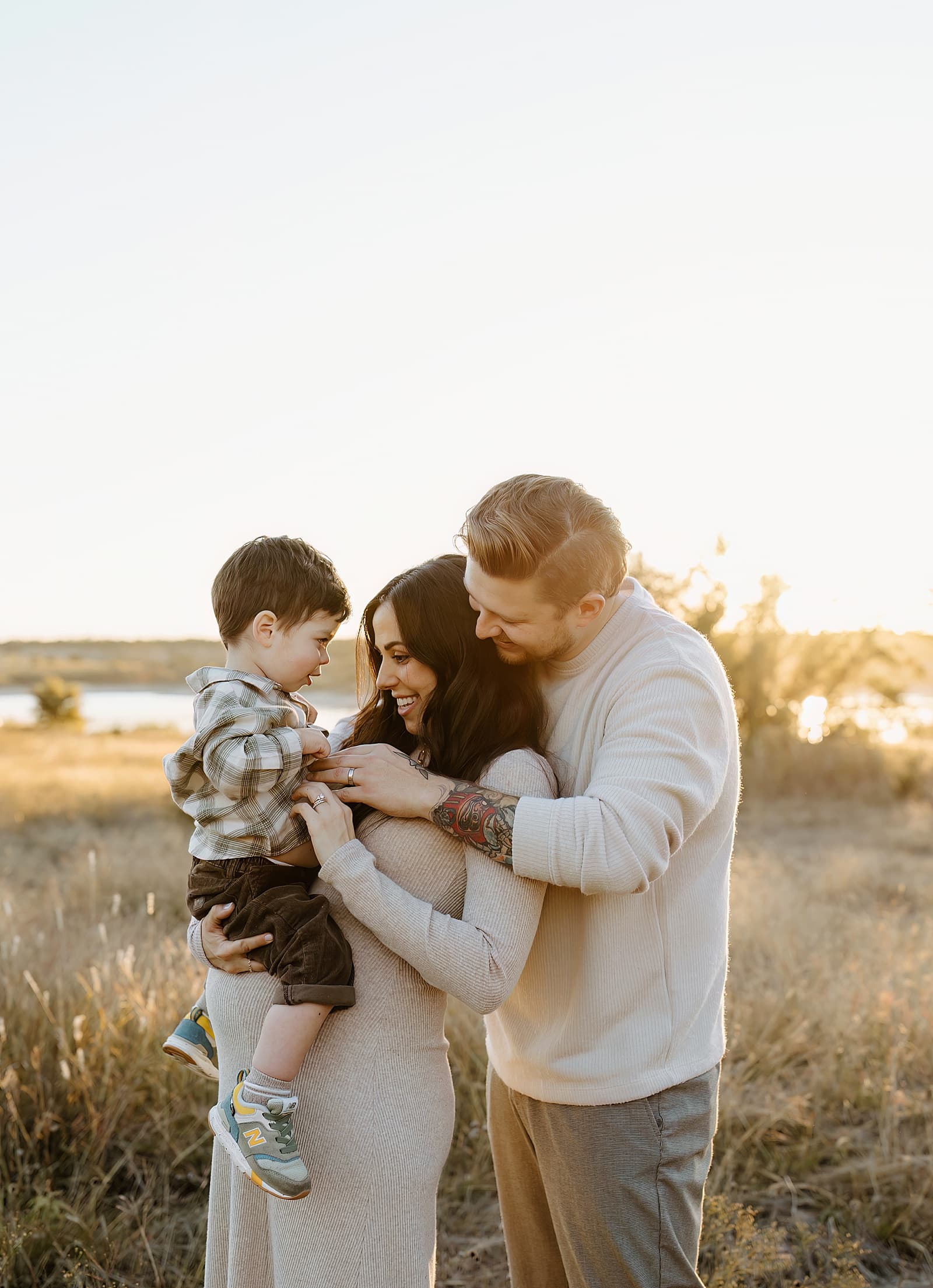 Parents smile with young son for Austin Motherhood Photographer
