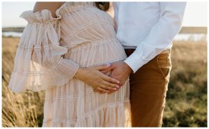 Mom and dad hold pregnant belly for Austin Motherhood Photographer