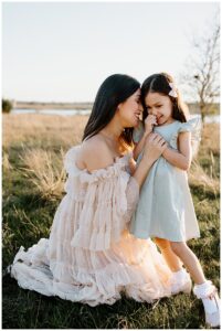 Mom hugs young daughter close for Our Adventuring Souls Photography