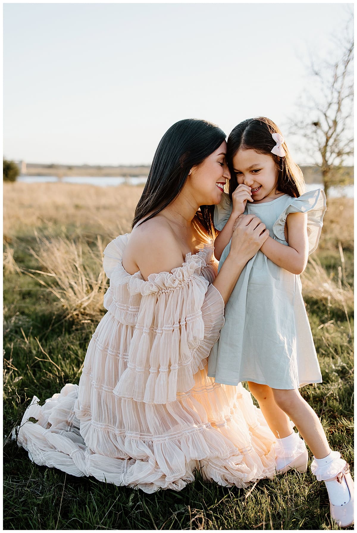 Mom hugs young daughter close for Our Adventuring Souls Photography