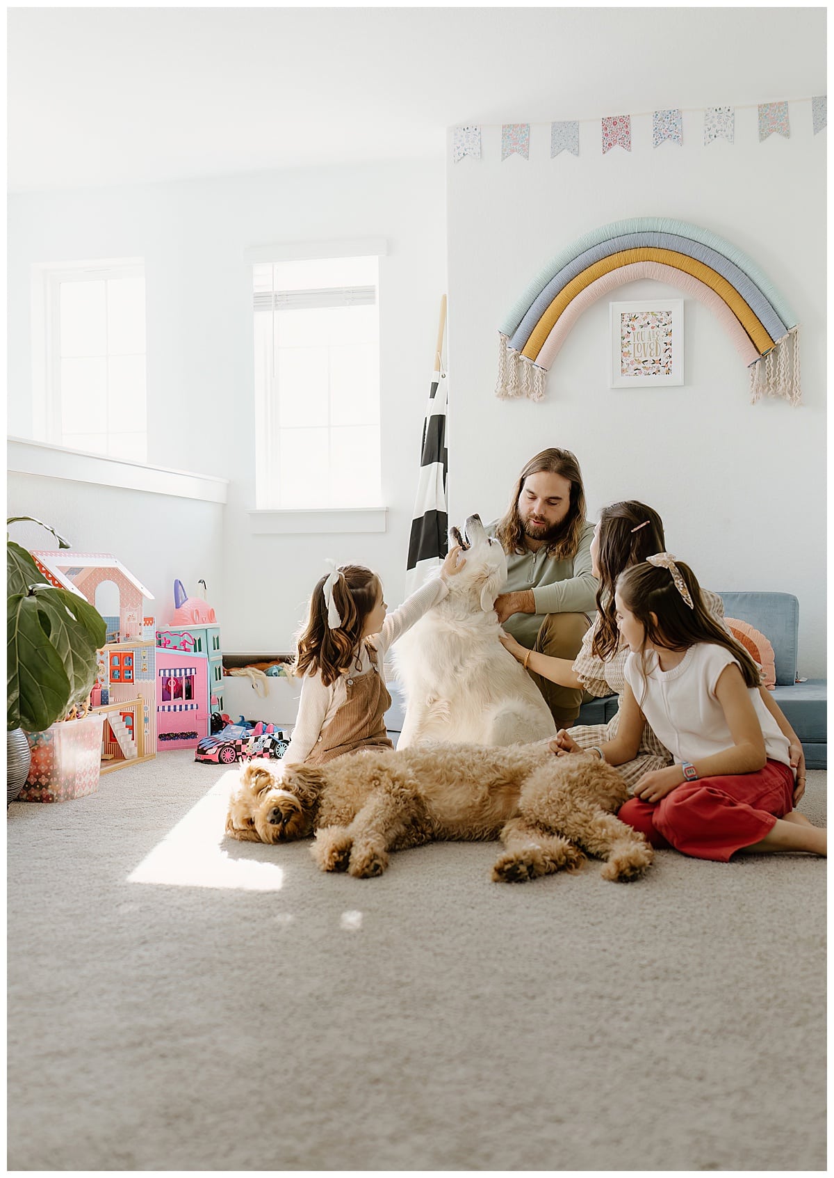 Parents and kids play together with their dog during In-Home Documentary Family Photos