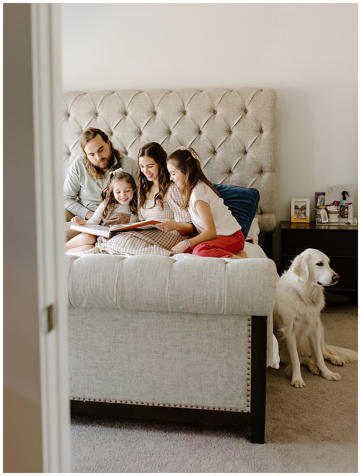 Family read together on the bed during In-Home Documentary Family Photos