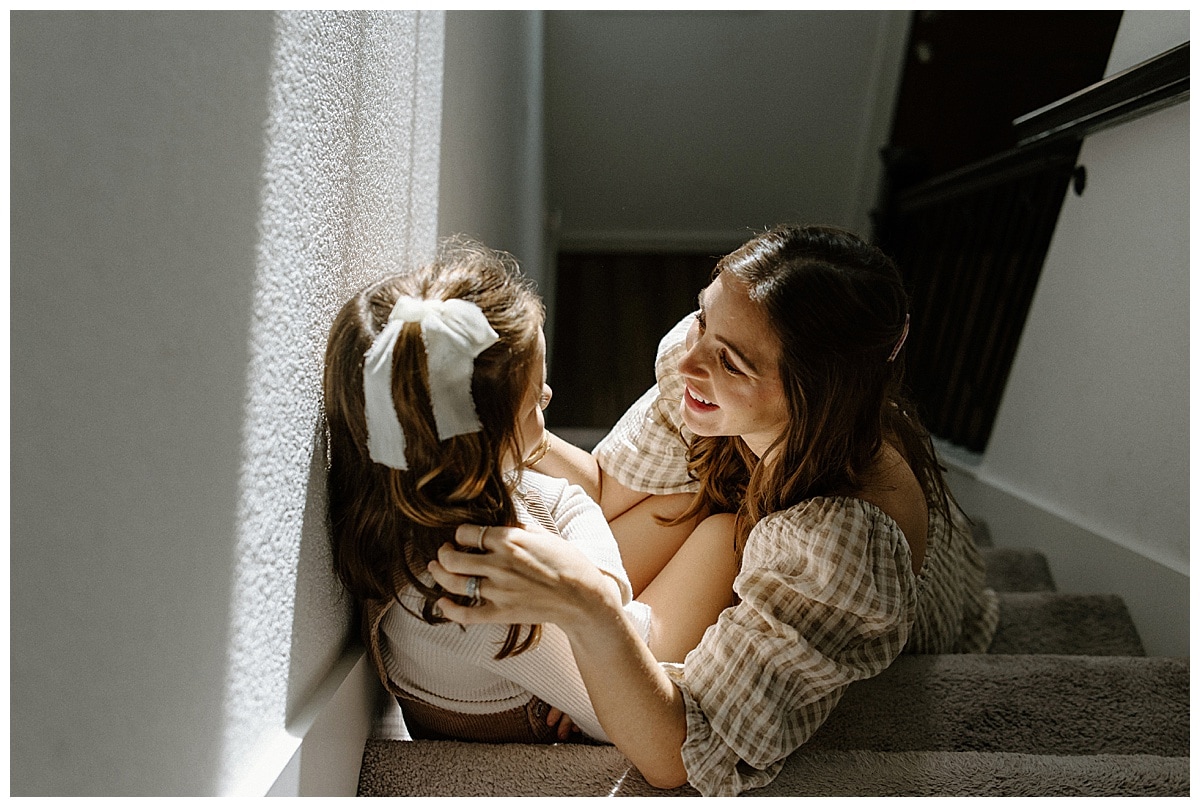 Mom smiles at young daughter for Austin Lifestyle Photographer