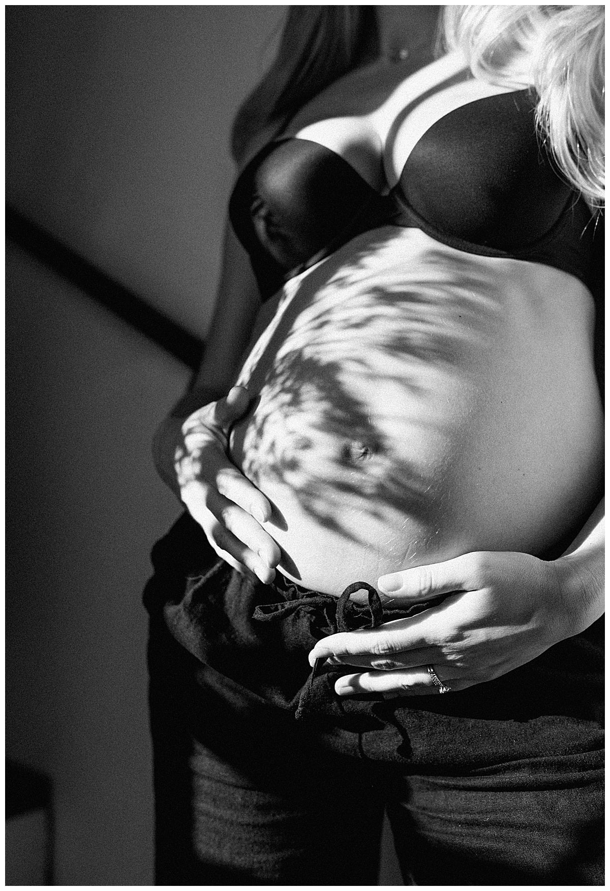 Woman holds onto her pregnant belly for Our Adventuring Souls Photography